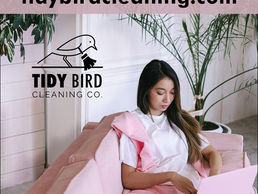 Lady in pink booking Tidybirdcleaning.com for house cleaning