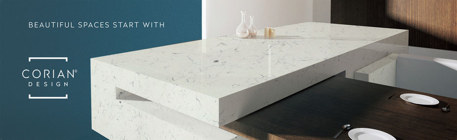 White marble countertop with vases and candle.