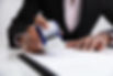 Close-up Of Businesswoman Putting Stamp On Documents In The Office.jpg