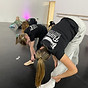 Flame Dance Studios teacher and child student stretching