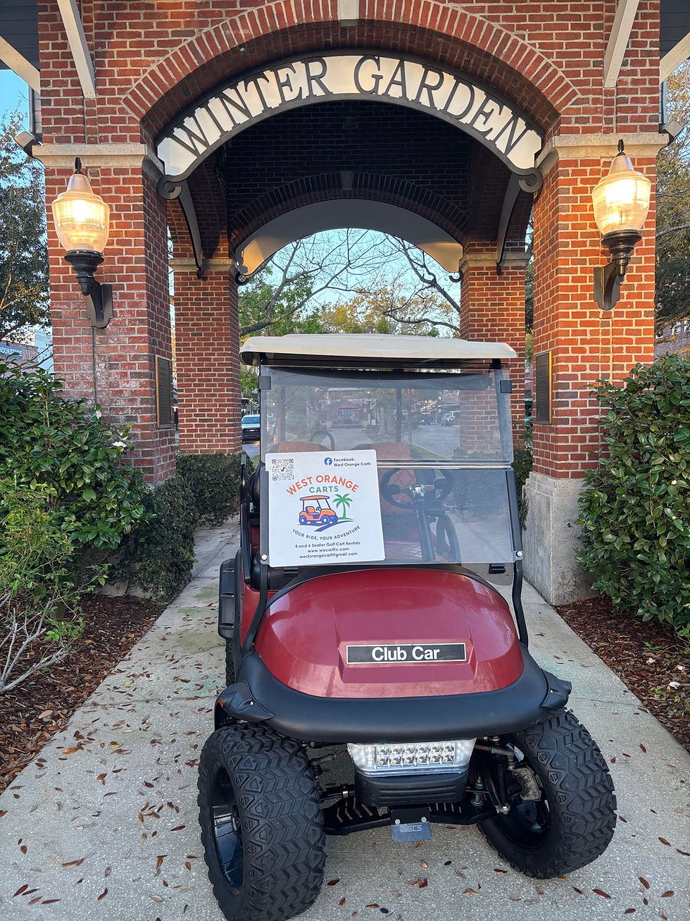 Eye-level view of a white golf cart parked near a golf course path