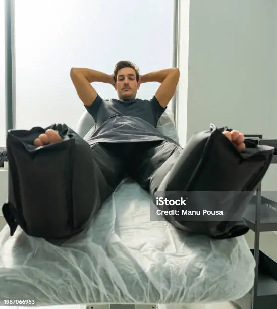 Compression boots on client's legs for recovery