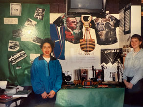 Shenandoah Chefalo after presenting ‘What is the Nature of Conflict and Resolution’ in high school, smiling near the project.