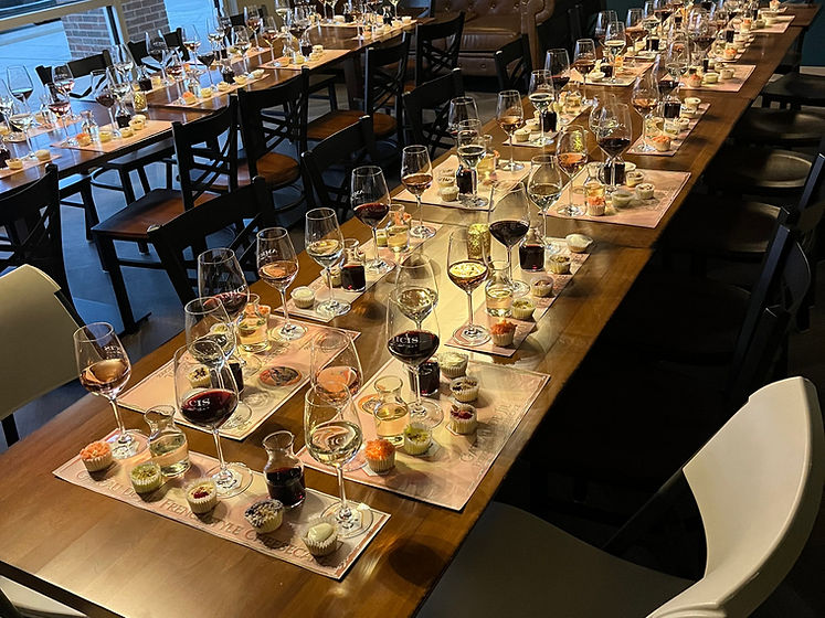 A tasting room set with cheesecake flights and wine pairings