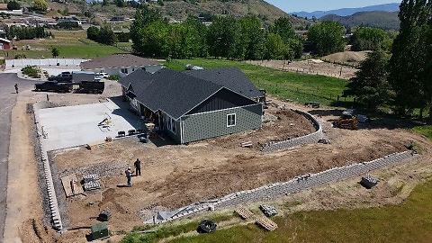 Finished hardscape and concrete project with retaining walls