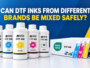 Two bottles of DTF ink from different brands next to a DTF printer, illustrating risks of mixing ink chemistries