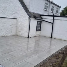 View of large garden with a patio area