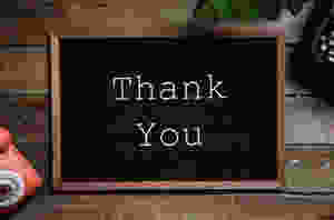 thank you text on black and brown board