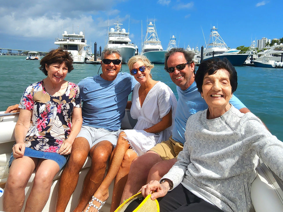 Enjoying a family gathering aboard the Bonnie Lee for a relaxing sightseeing cruise in Riviera Beach