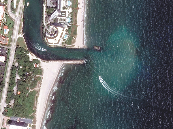 narrow inlet showing shoaling as a result of littoral drift