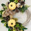 Thumbnail: Autumn half wreath with pumpkins and pine cones