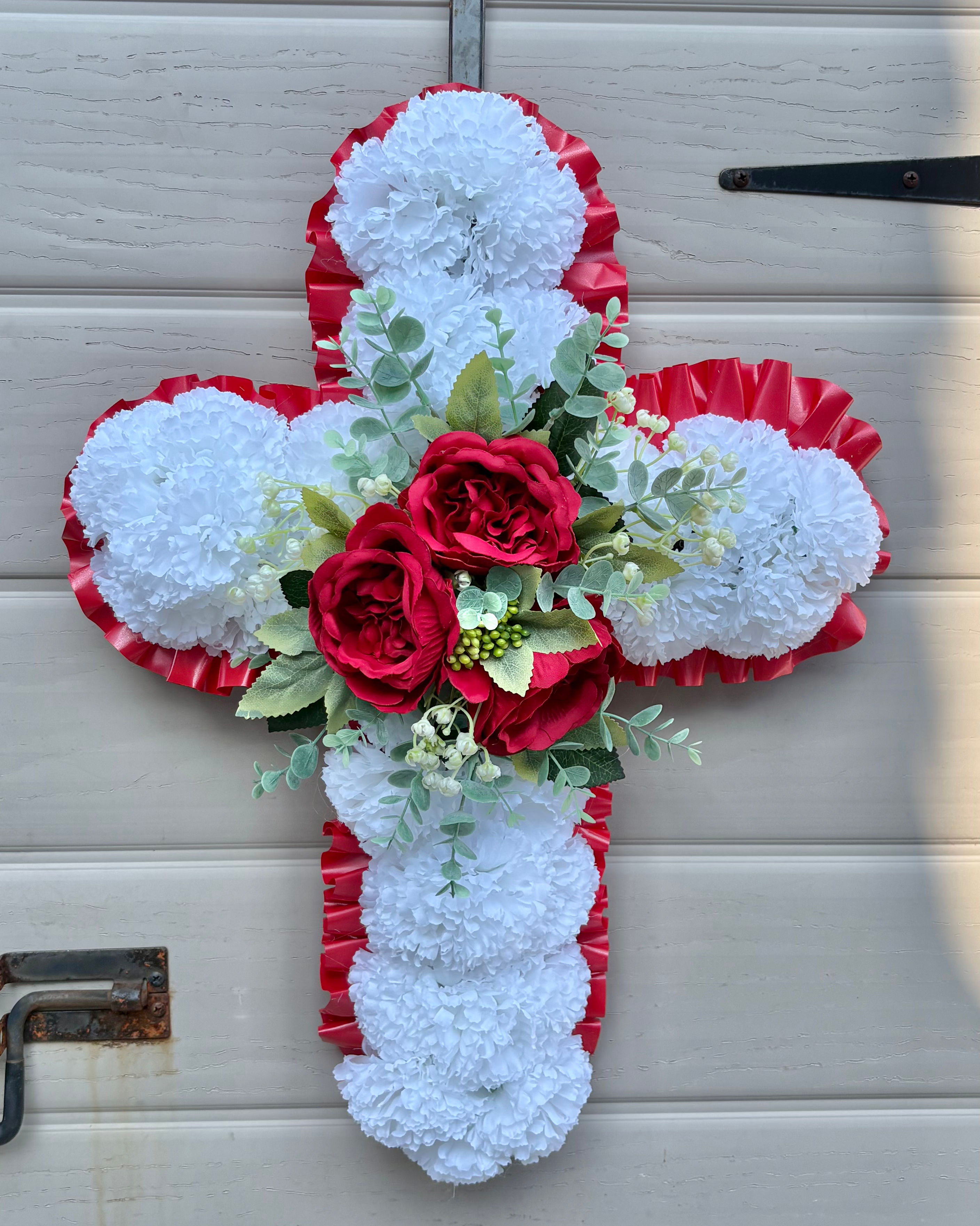 Handmade graveside cross with red roses 