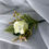 Thumbnail: Cream rose boutonniere with greenery