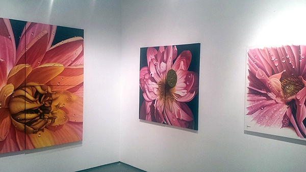 Paintings of flowers at an exhibition