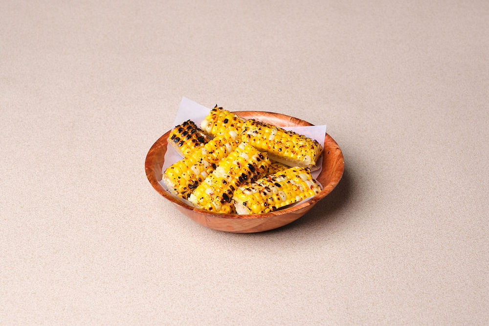 Grilled sweet corn ribs dusted with a coastal Kenyan chili-lemon spice – think of it as the East African cousin to Tajin!