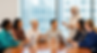 Group of Diverse Business Women Around a Table.png