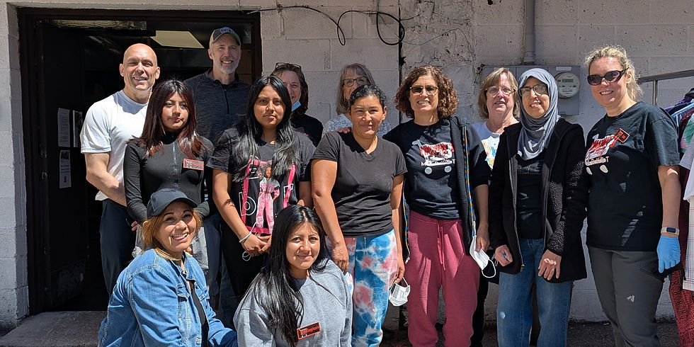 A group of volunteers outside of the Market