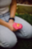 Thoughtfully holding flower from garden