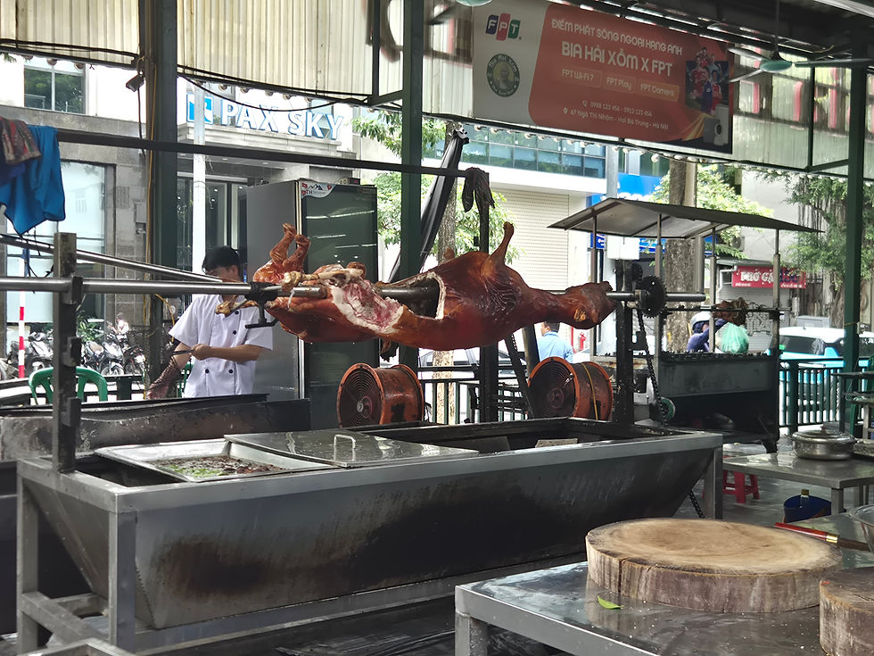 dog being grilled on spit in hanoi vietnam