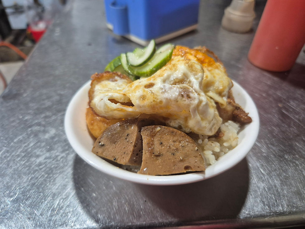 Xôi Xéo- Sticky rice, pork and topped with an egg.