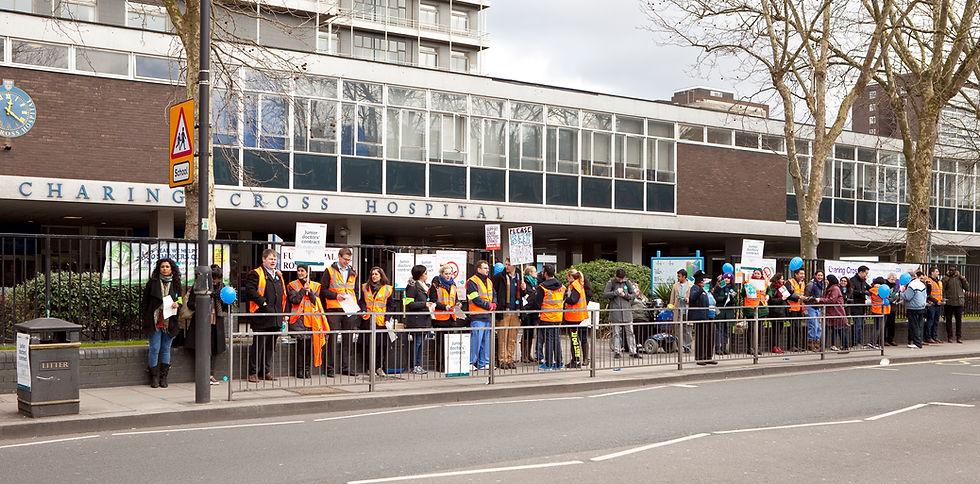 Junior doctors on strike over the doctors’ pay dispute, holding placards and calling for fair treatment in the NHS.
