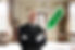Horizontal shot of a butler standing with arms crossed and holding a duster in his hands w