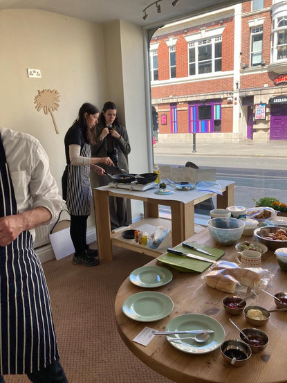 Cooking class participants preparing food