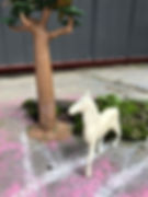 toy horse beside toy tree for STEAM fairy houses activity