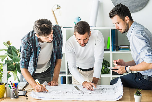 group-male-architect-analyzing-blueprint.jpg