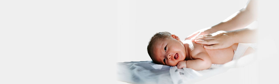 baby laying on the bed after being delivery through our surrogate.jpg