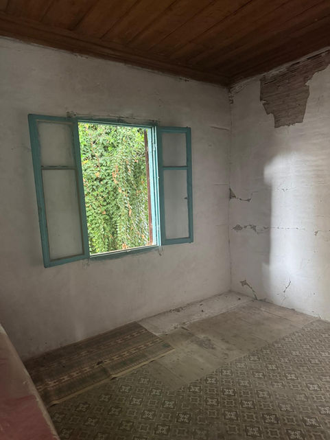 Room in an authentic house for sale near Vasiliki with a window open to greenery