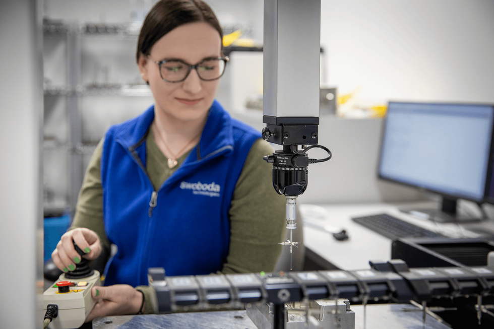 Woman Operates Sophisticated Equipment