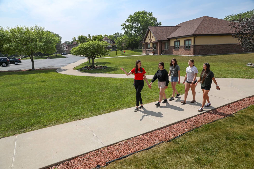 Staff member speaks to students during tour