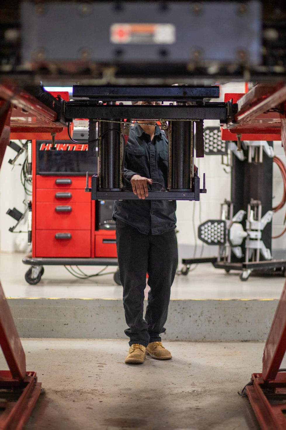 Auto student under a vehicle