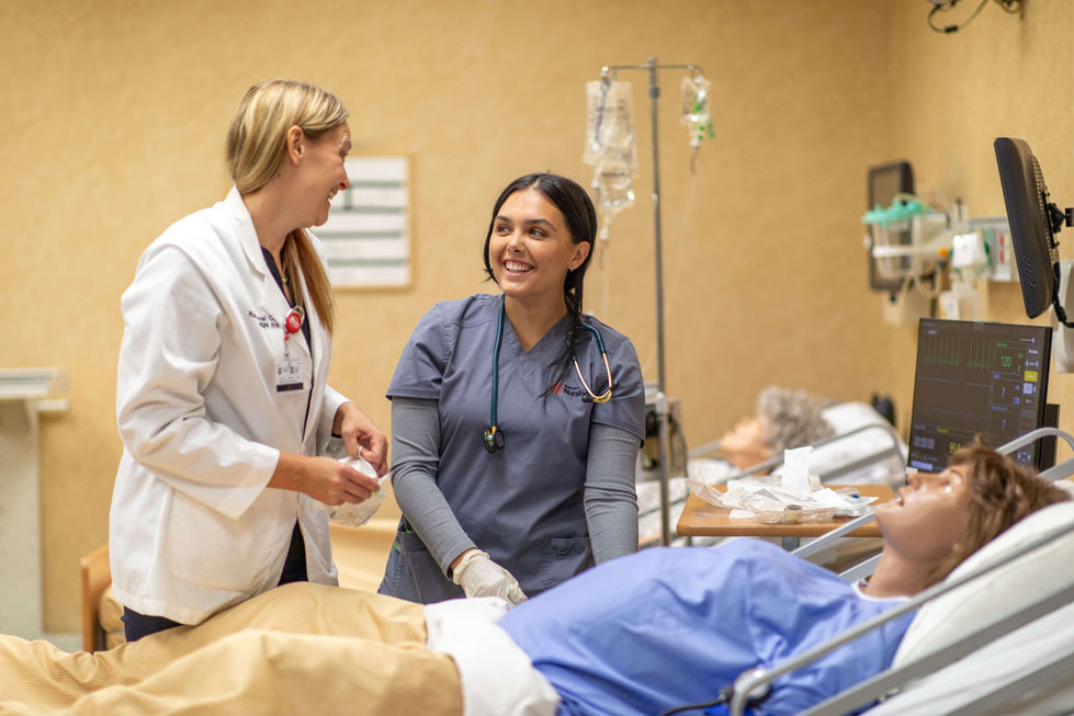 Nursing student and instructor in lab
