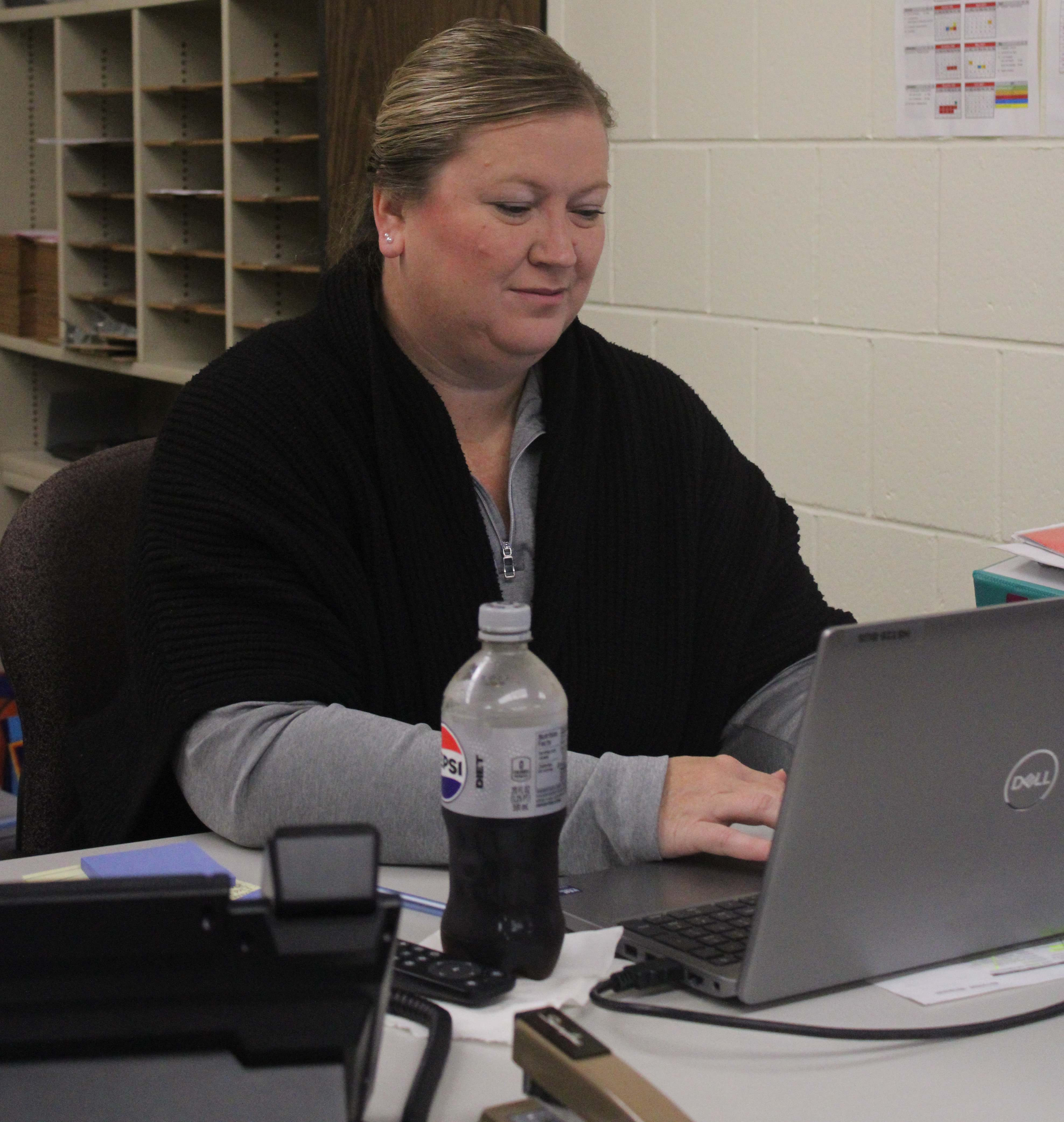 TEACHER WITH NEW RESPONSIBILITIES - Business teacher Amanda Lee works at her desk. Lee accepted several new responsibilities for the 2026-2027 school year. Photograph by Brooklyn Kellams