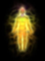 Glowing silhouette of a person with a vibrant aura of yellow and orange colors on a dark background, creating a mystical atmosphere.