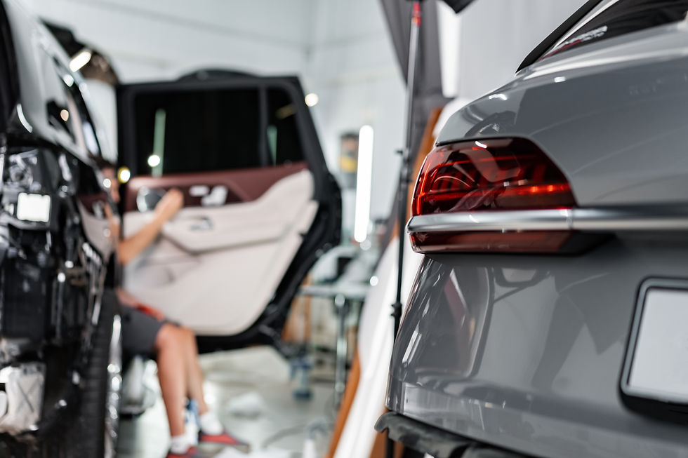 car-wrapping-process-close-up-of-man-putting-inte-2023-11-27-04-59-15-utc.jpg