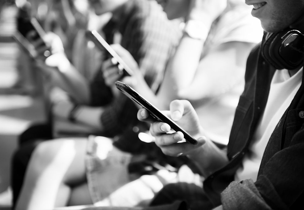 group-of-young-adult-friends-using-smartphones-in-2026-03-18-13-42-46-utc.jpg