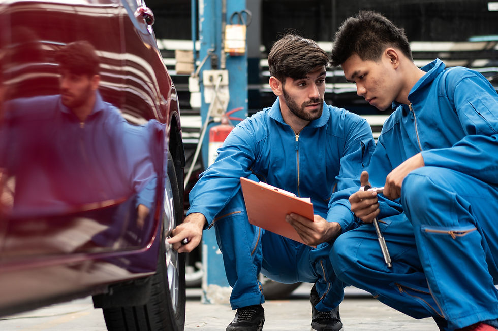 automotive-mechanic-men-checking-at-car-tyre-rubbe-2023-11-27-05-12-31-utc.jpg