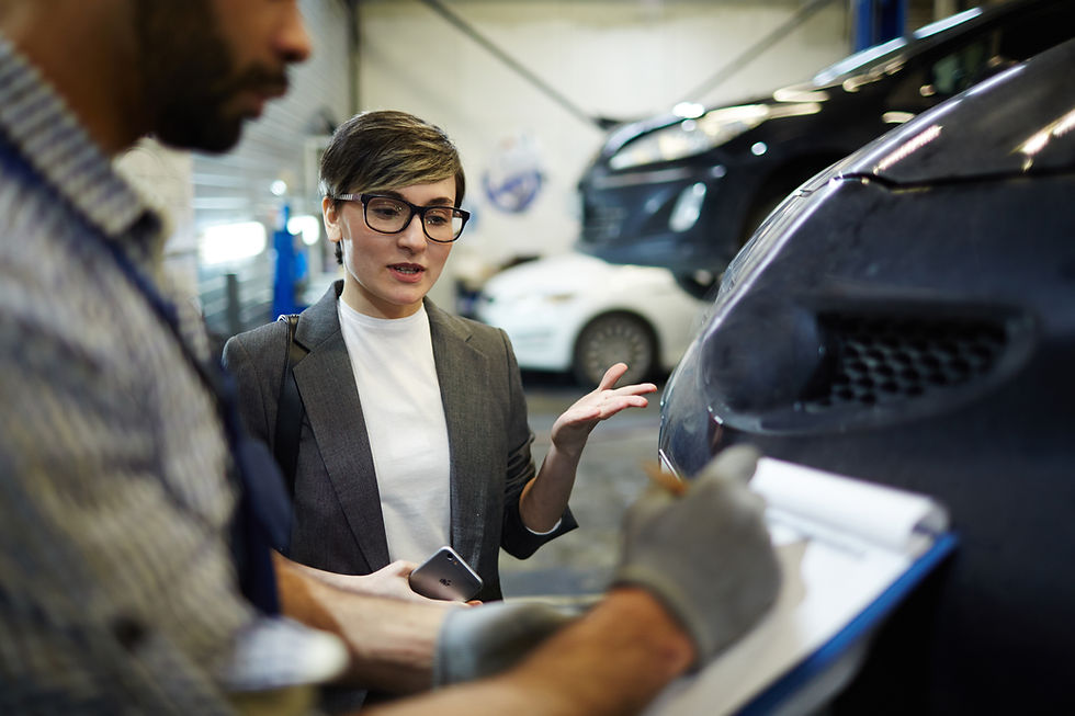 car-dealership-manager-shows-cars-to-a-young-famil-2024-10-18-08-22-28-utc.jpg