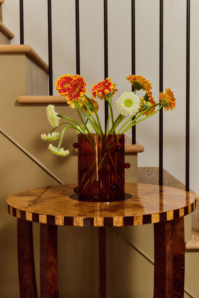 Close-up of olive burl wood grain on Roman side table showing natural movement and depth