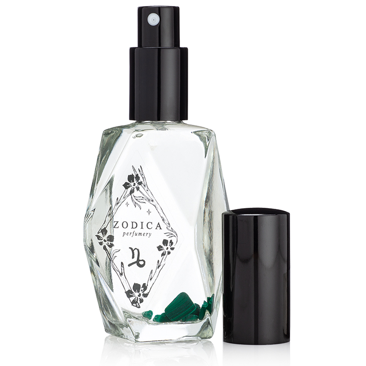 Capricorn crystal-infused perfume bottle with Malachite crystals inside, styled to reflect cool, herbal clarity