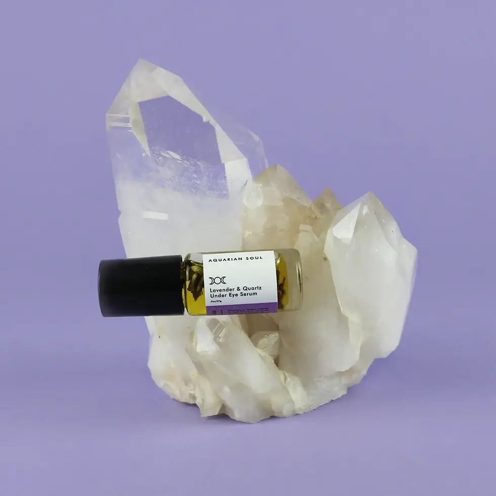 Lavender Clear Quartz under eye serum set on clear quartz against a dreamy purple background