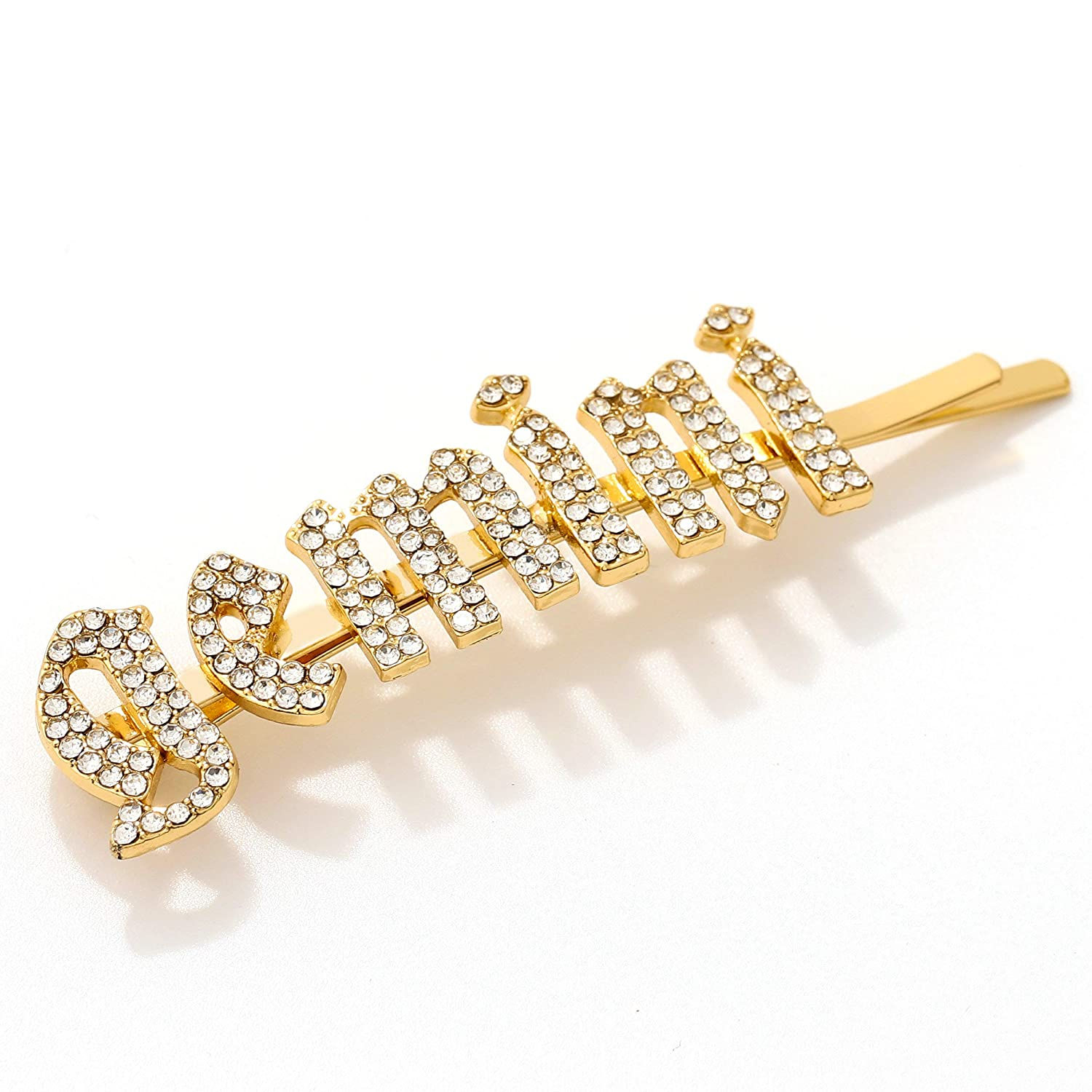 Gold Gemini rhinestone bobby pin hair clip sparkling on white background