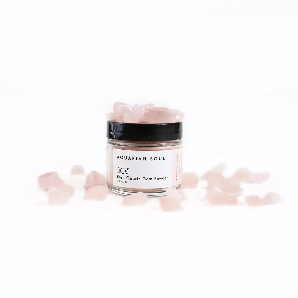 Closed jar of Rose Quartz Gem Powder Clay Mask surrounded by small rose quartz crystals on a white background