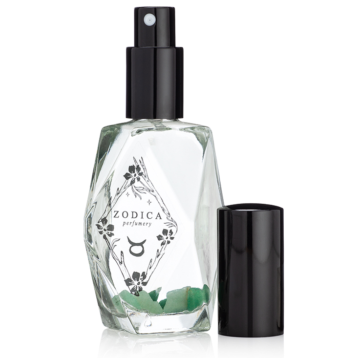 Taurus crystal-infused perfume bottle with visible Indian Jade crystals inside, reflecting beauty and grounded elegance