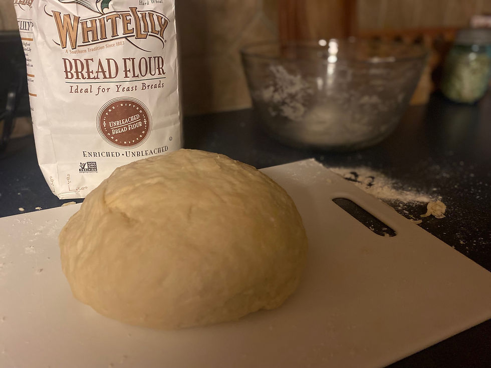 Making the bread--one thing different about this recipe than other recipes I have used in the past is to add the flour gradually. I stir about three of the six cups of flour into the liquid mixture first and then add the remaining three cups, using my hands to work the dough into a ball. Use a small amount of flour as you are working and kneading the dough. Kneading the dough is the most important part--set a timer for five minutes, Kara suggests and she explains, it's a good hand and arm workout--good therapy!