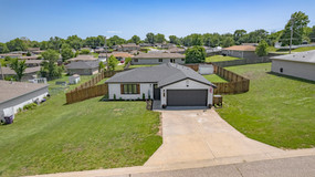Aerial drone image of real estate property and surrounding neighborhood in Ogden KS
