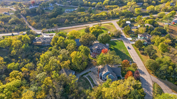 Aerial drone image of property and surrounding neighborhood in Manhattan, KS
